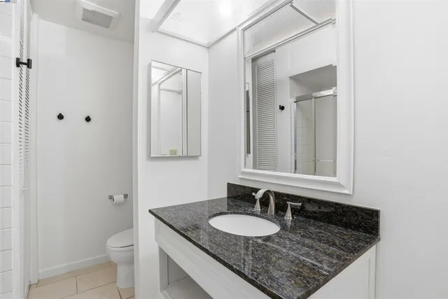 a bathroom with a sink and mirror
