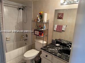 3571 Inverrary Drive, Unit 408 Lauderhill, FL 33319 - Photo 3 of 13 a bathroom with a toilet and a shower