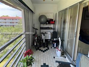 3571 Inverrary Drive, Unit 408 Lauderhill, FL 33319 - Photo 7 of 13 a view of a hallway with wooden floor and door
