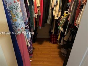 3571 Inverrary Drive, Unit 408 Lauderhill, FL 33319 - Photo 10 of 13 a view of walk in closet with clothes