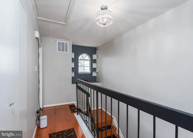 a view of a hallway with windows
