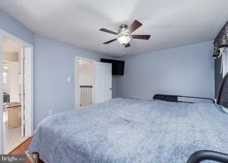 a view of empty room with ceiling fan