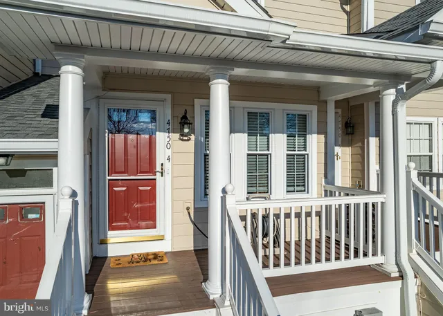 a view of a porch with a table and chair