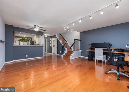 a view of a livingroom with furniture and stairs