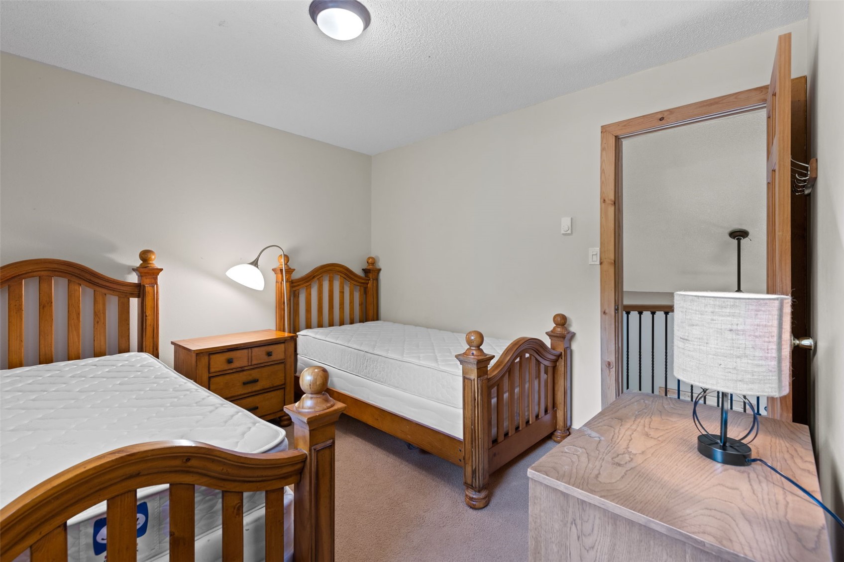 283 Range Road, Unit 4 Breckenridge, CO 80424 - Photo 19 of 32 Bedroom with carpet and two beds.
