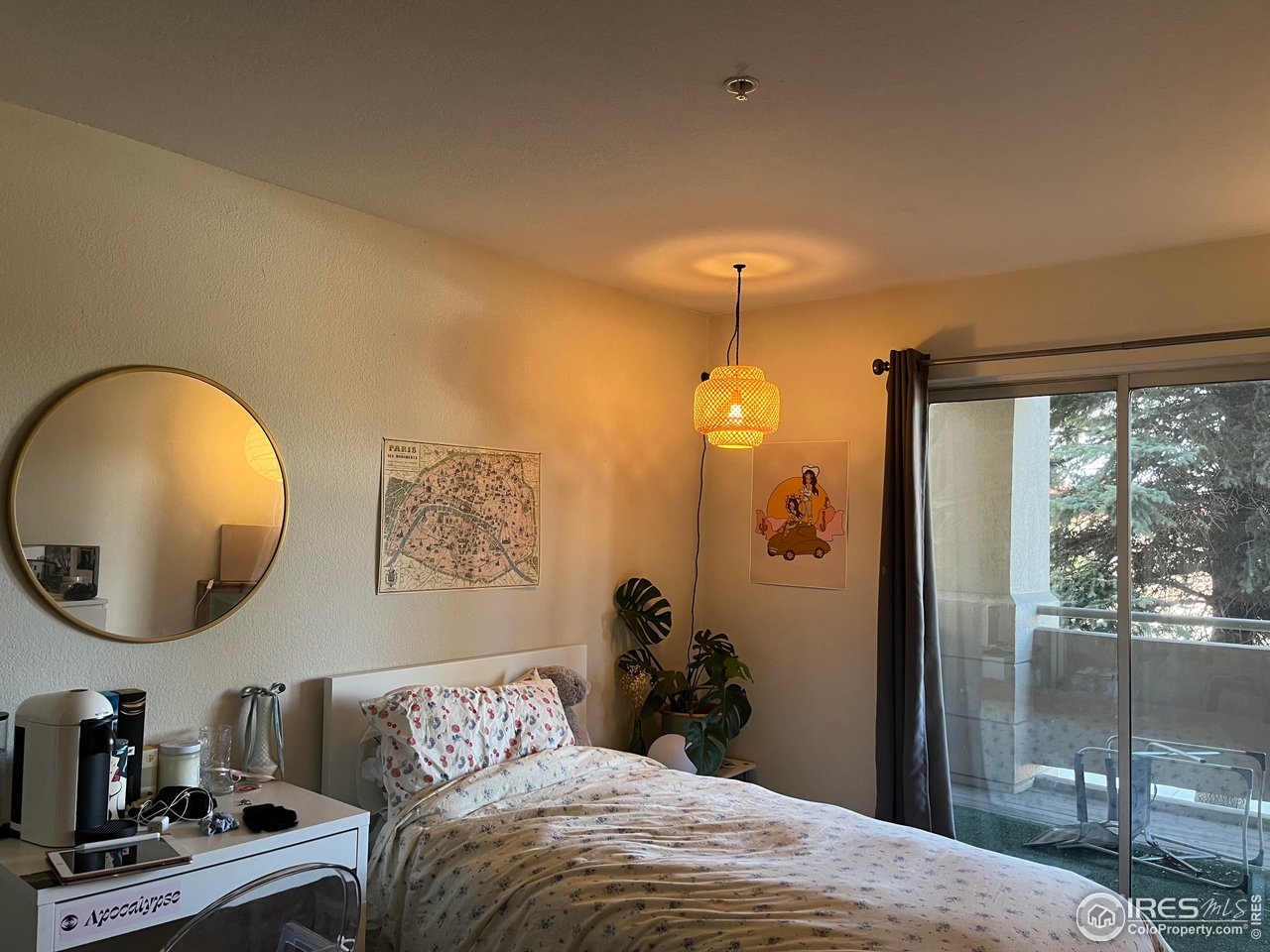 935 Broadway, Unit 106 Boulder, CO 80302 - Photo 10 of 34 a bedroom with a bed and a mirror