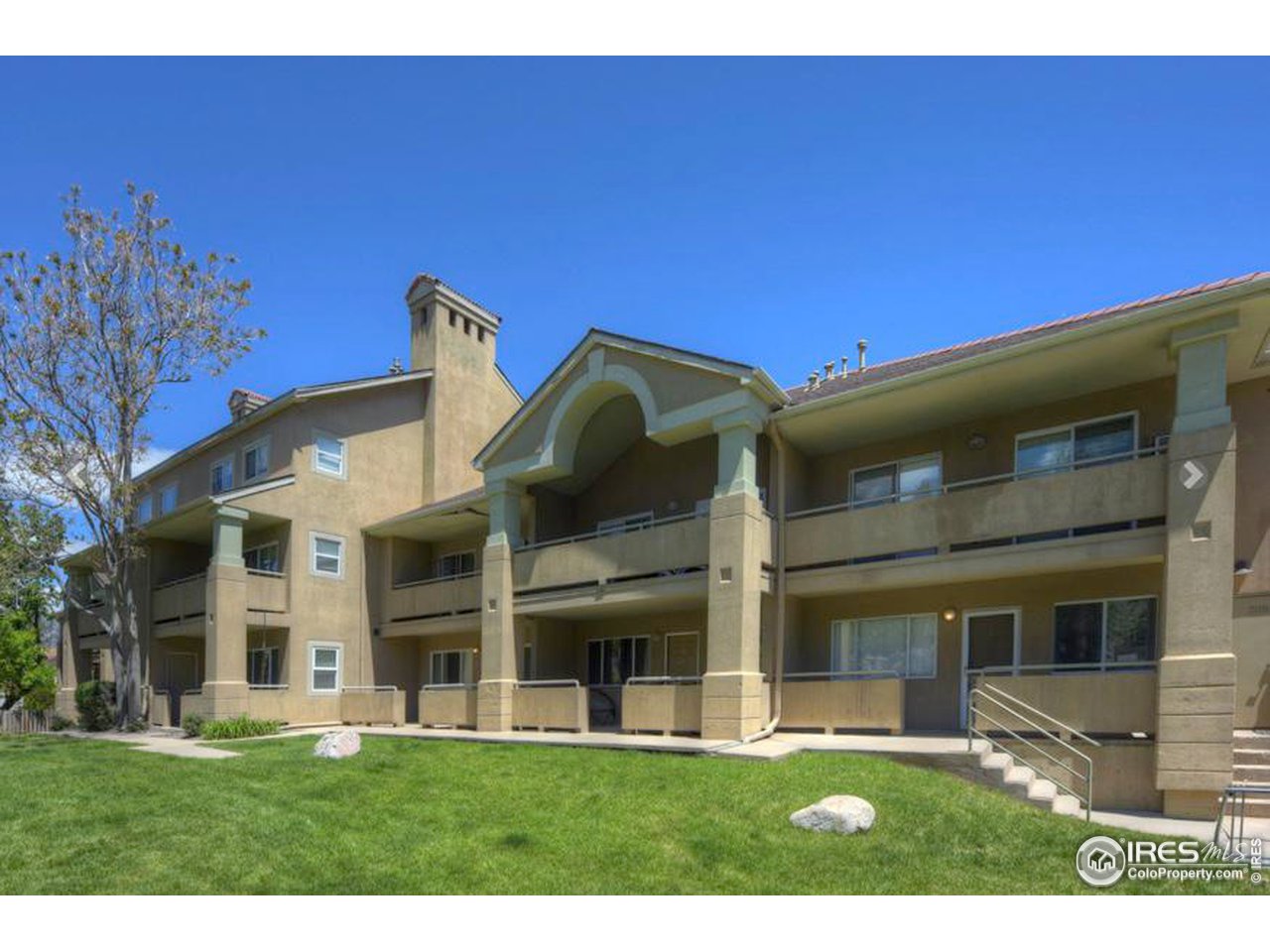 935 Broadway, Unit 106 Boulder, CO 80302 - Photo 22 of 34 a view of a building with a yard