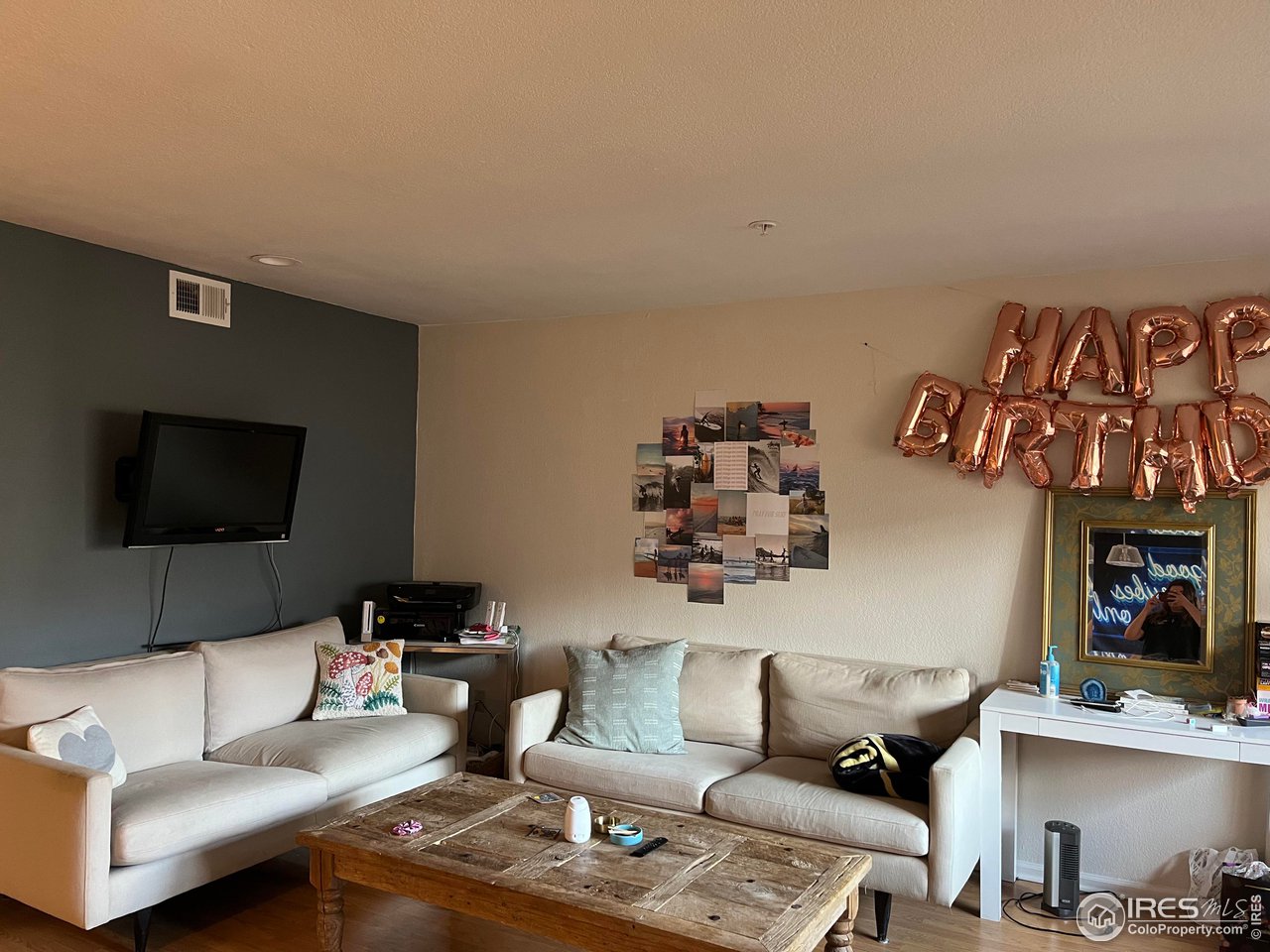 935 Broadway, Unit 106 Boulder, CO 80302 - Photo 34 of 34 a living room with furniture and a flat screen tv