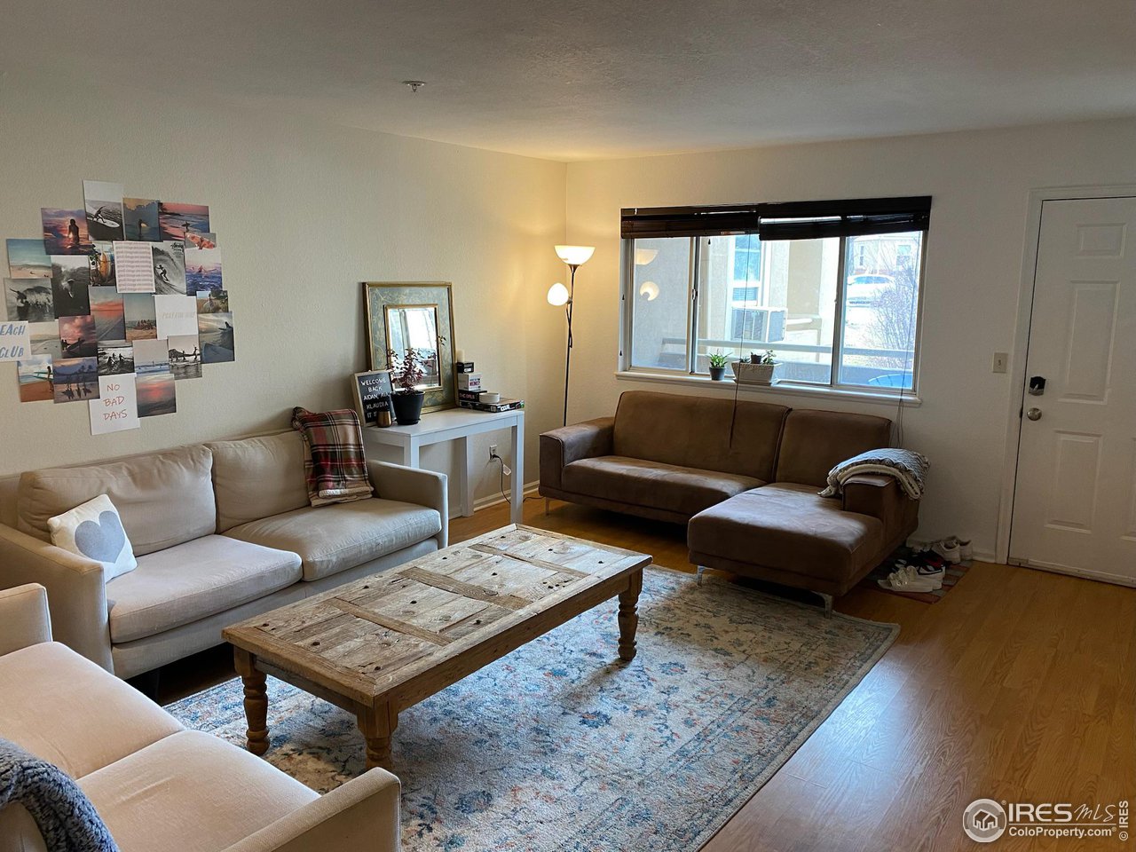 935 Broadway, Unit 106 Boulder, CO 80302 - Photo 5 of 34 a living room with furniture a rug and a window