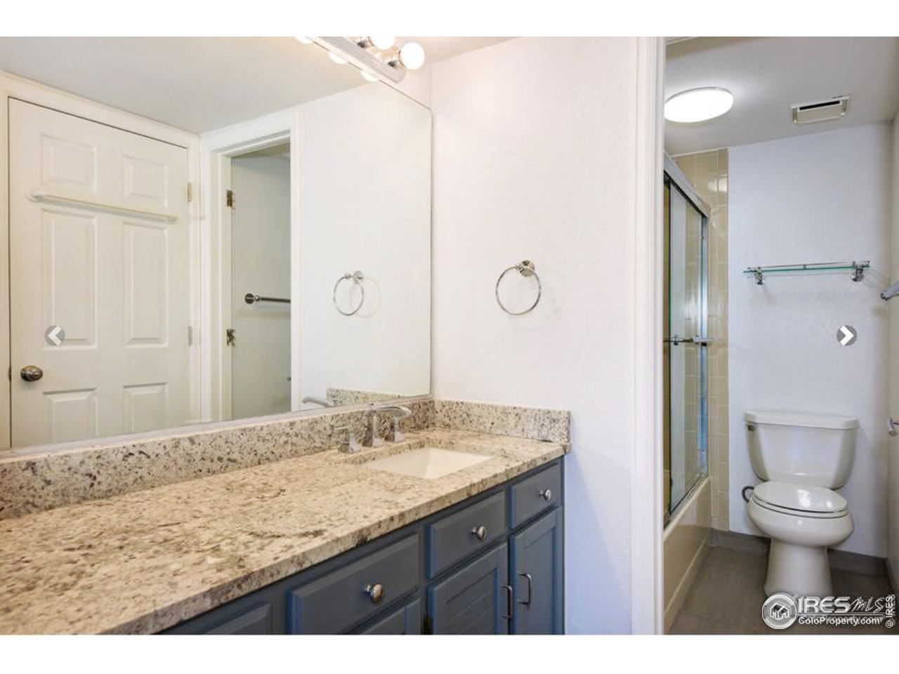 935 Broadway, Unit 106 Boulder, CO 80302 - Photo 9 of 34 a bathroom with a granite countertop sink toilet and shower