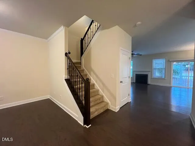 a kitchen with stainless steel appliances granite countertop a refrigerator a sink dishwasher a stove and a microwave oven on granite countertops