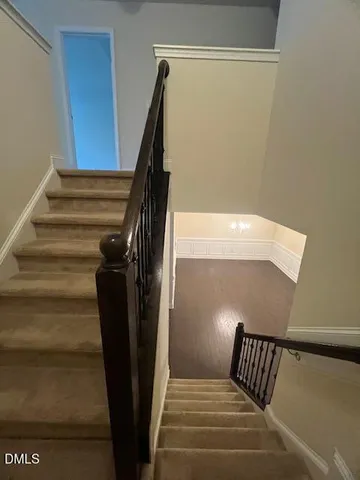 a view of a hallway with staircase