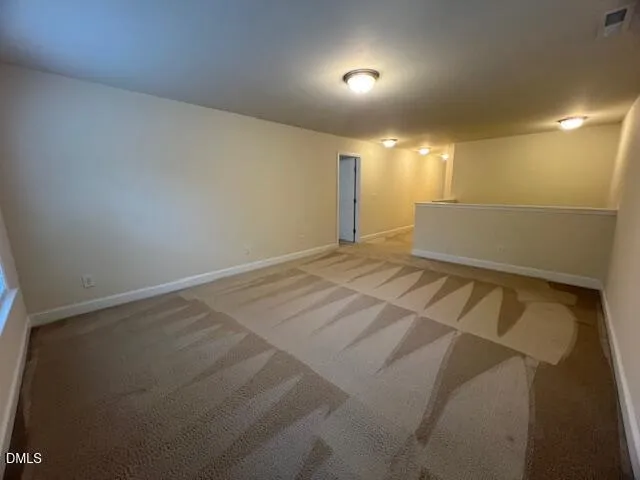 an empty room with a empty space and window