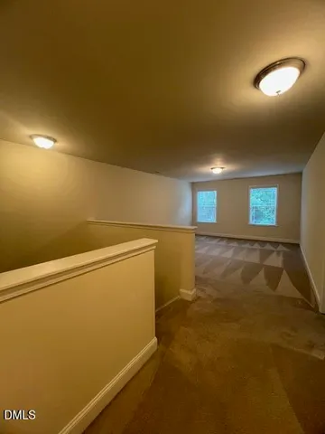 a view of a porch with wooden floor and outdoor space