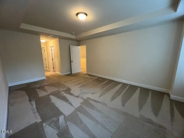 a large kitchen with stainless steel appliances a large counter top a stove a sink dishwasher and a refrigerator