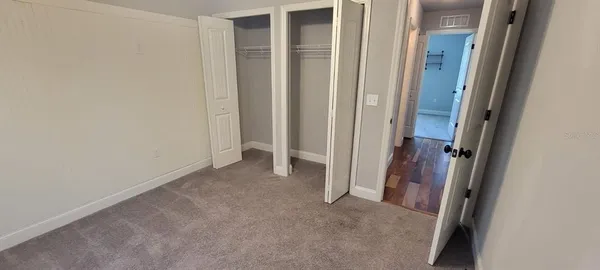 a view of a livingroom from a hallway