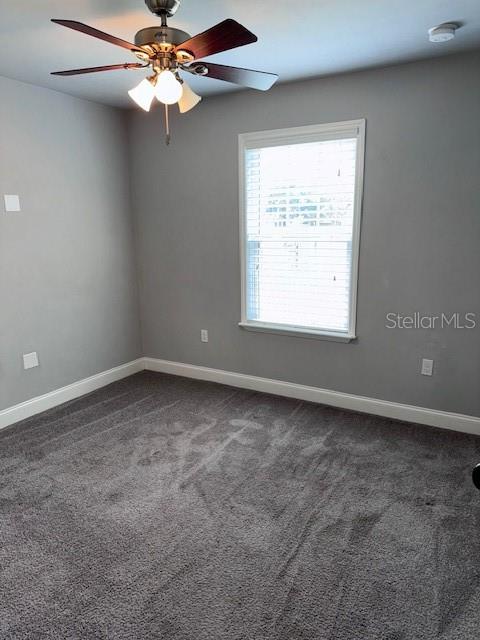 2032 Southwest 252nd Street Newberry, FL 32669 - Photo 17 of 23 an empty room with a window and a fan