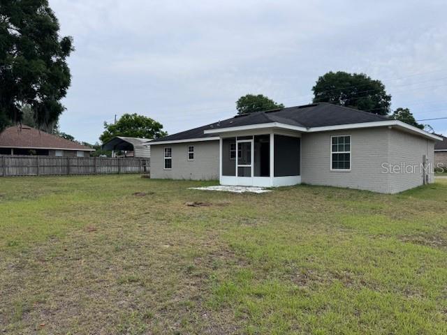 2032 Southwest 252nd Street Newberry, FL 32669 - Photo 21 of 23 a front view of a house with garden