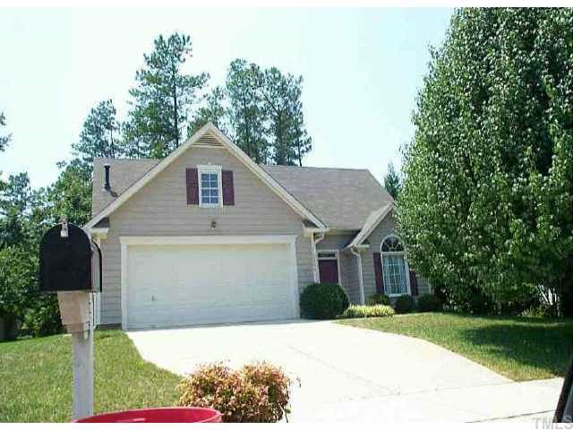 11204 North Radner Way Raleigh, NC 27613 - Photo 1 of 1 a front view of a house with a yard and garage