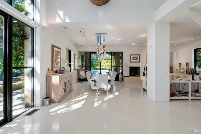 a living room with furniture a chandelier and a chandelier