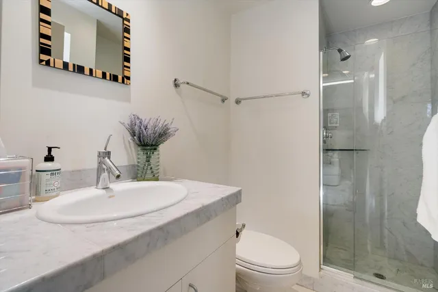 a bedroom with a bed wooden floor and furniture