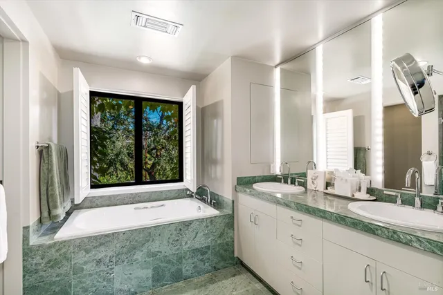 a view of backyard with outdoor seating and green space