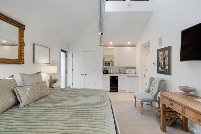 a backyard of a house with table and chairs