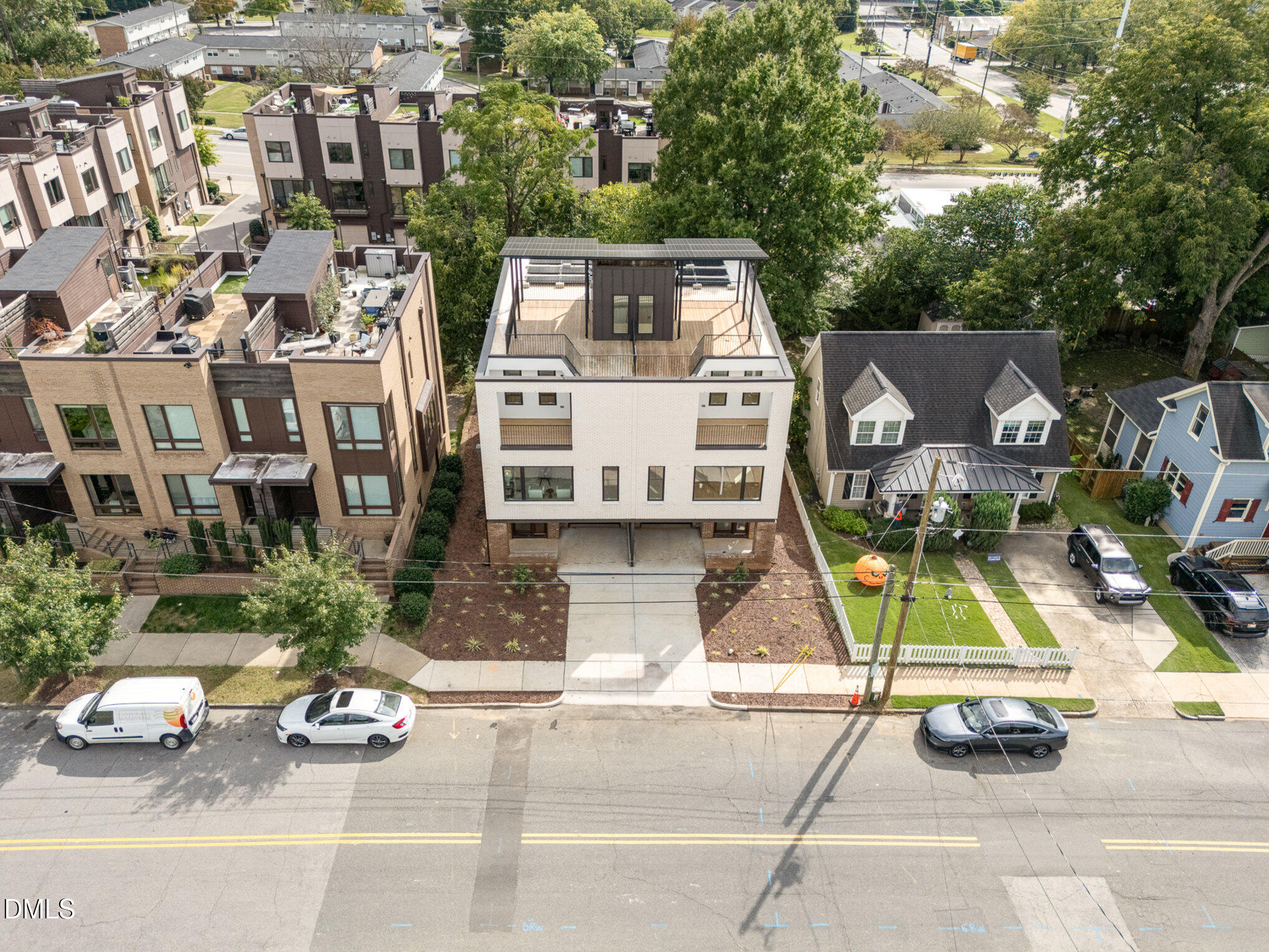 515 West Lenoir Street, Unit 102 Raleigh, NC 27601 - Photo 38 of 41 an aerial view of a house with a garden and parking space