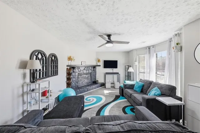 a living room with furniture and a flat screen tv
