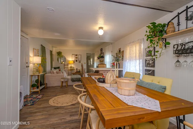 a living room with furniture and flowers