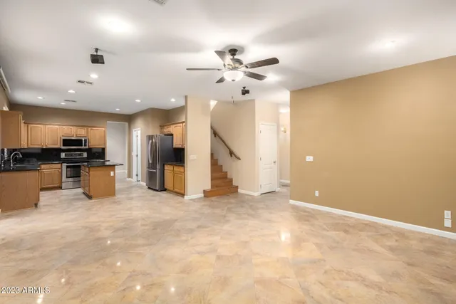 a view of a livingroom with furniture and a kitchen
