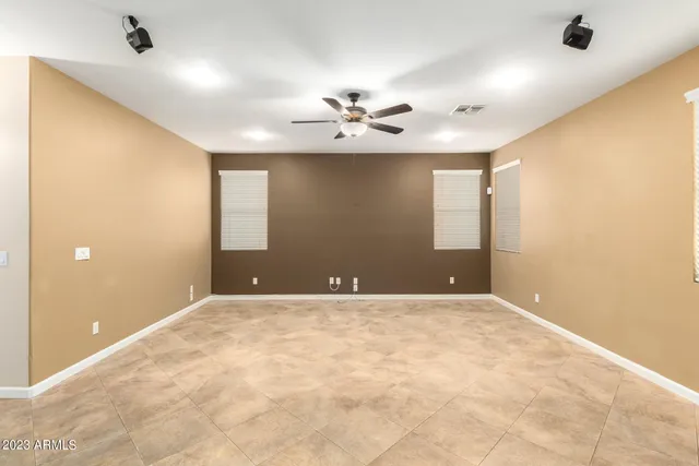 a kitchen with granite countertop sink stove and cabinets