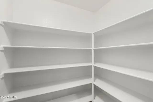 a kitchen with stainless steel appliances granite countertop a sink and a refrigerator