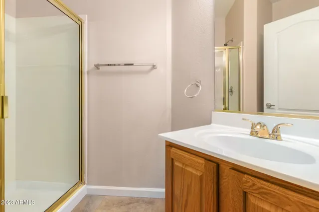 a white toilet sitting next to a shower