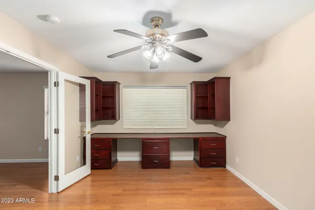 a large kitchen with stainless steel appliances granite countertop a sink and cabinets