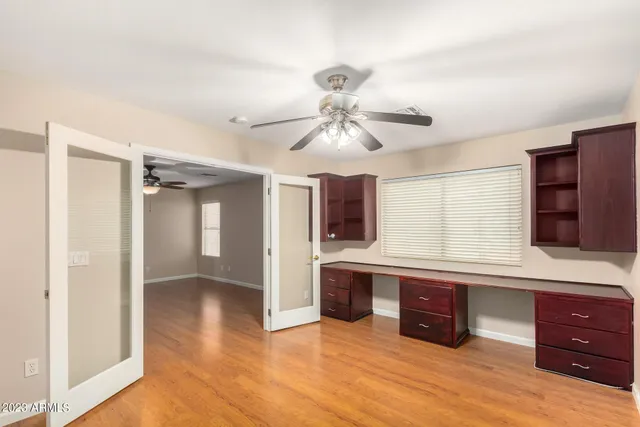a view of staircase with white walls and a table