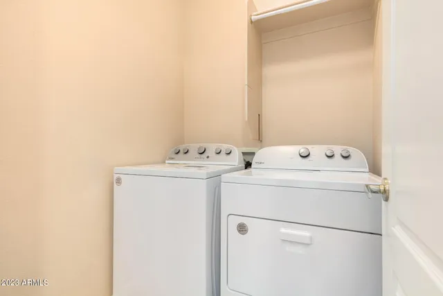 a backyard of a house with lots of green space and plants