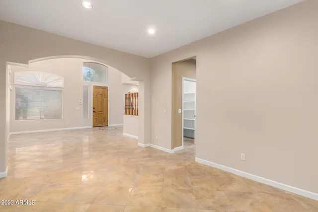 a view of a kitchen with furniture and a ceiling fan
