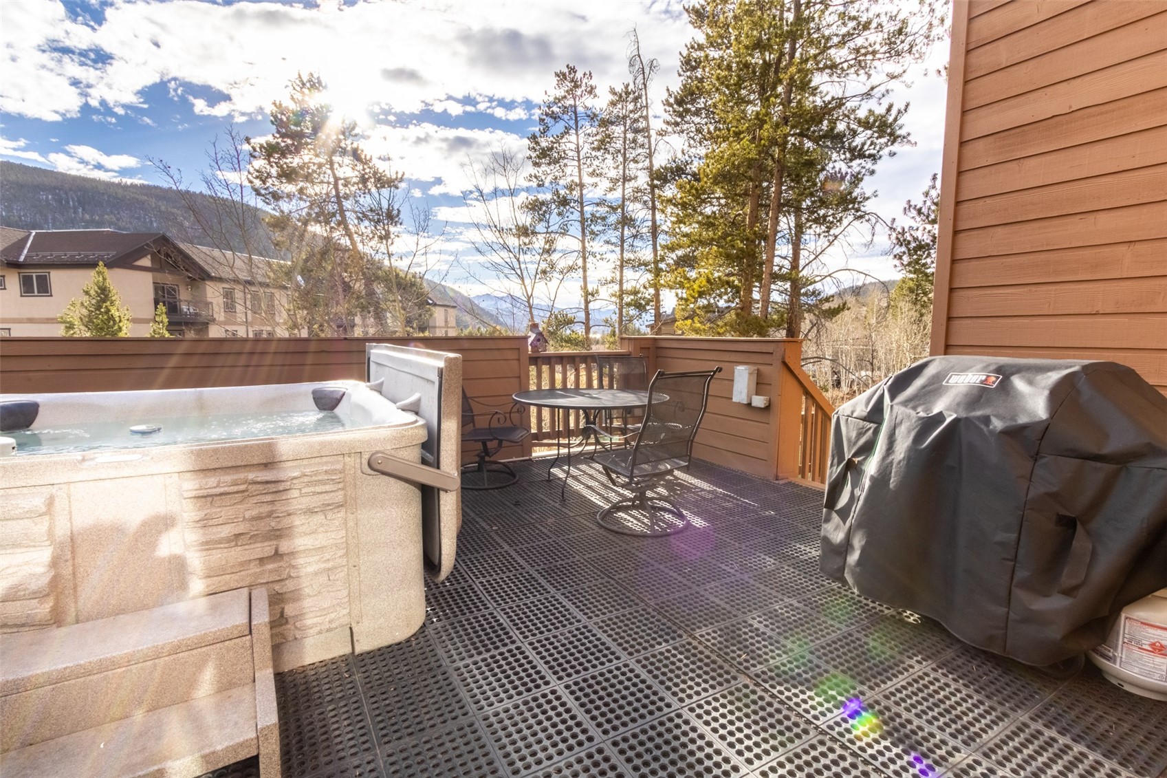 67 West Hansen Road Keystone, CO 80435 - Photo 35 of 42 View of patio featuring a hot tub and area for grilling,