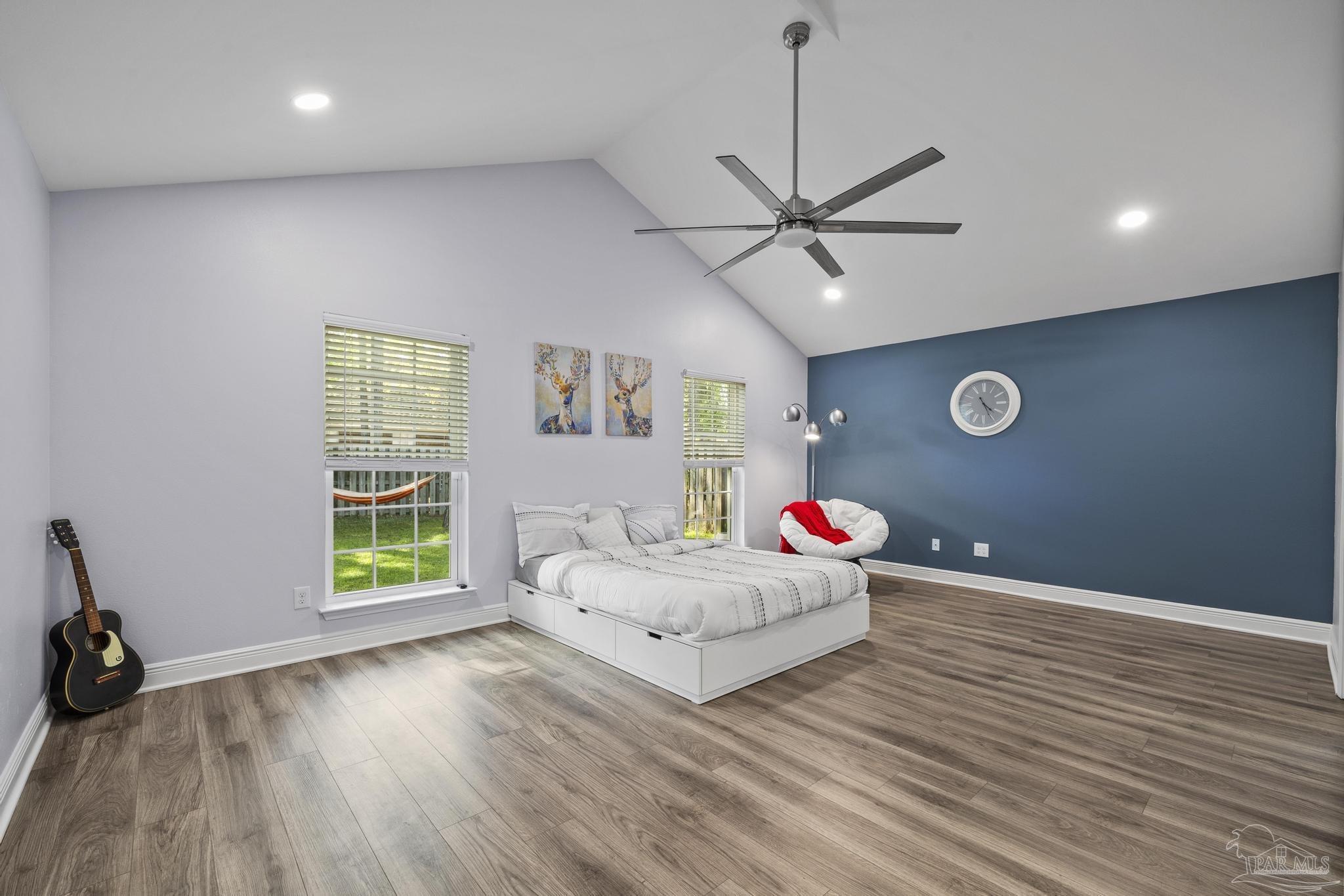 5981 Dunridge Drive Pace, FL 32571 - Photo 18 of 39 a living room with hard wood floors and a ceiling fan