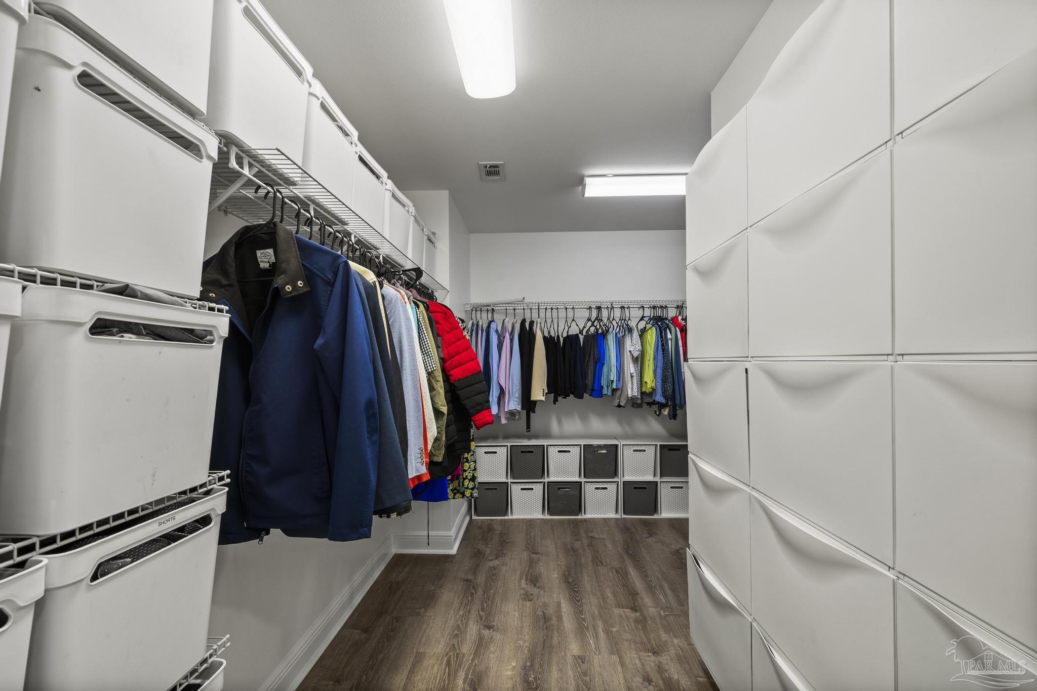 5981 Dunridge Drive Pace, FL 32571 - Photo 20 of 39 a view of walk in closet with clothes and shoes