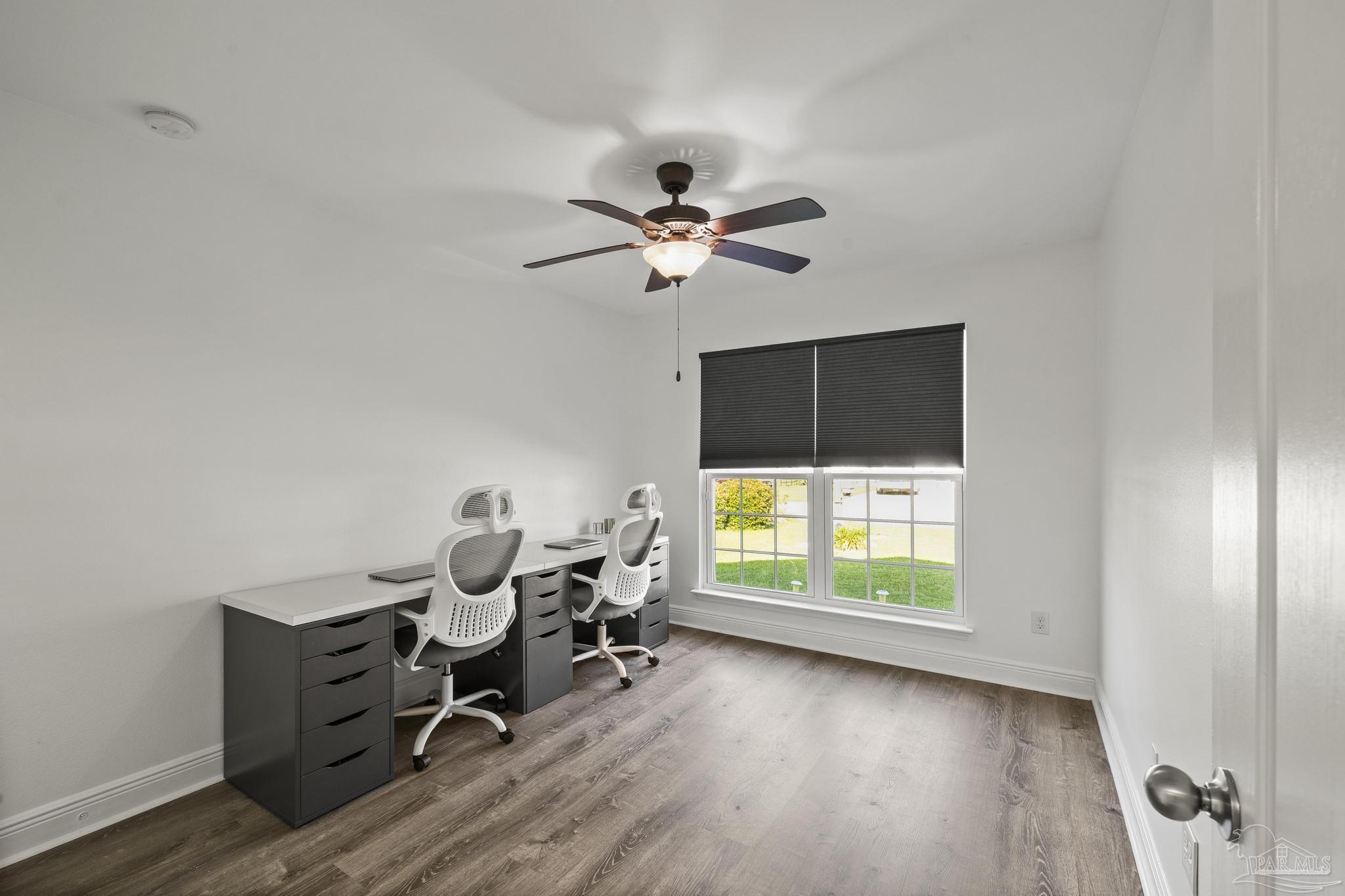 5981 Dunridge Drive Pace, FL 32571 - Photo 24 of 39 a living room with furniture hardwood floor and a window