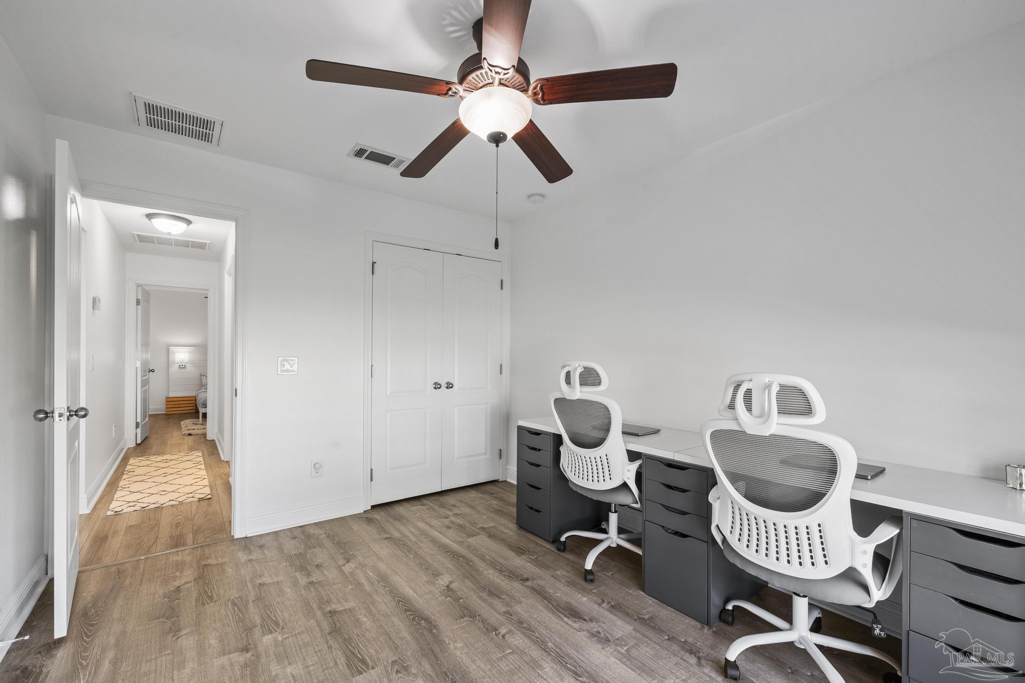 5981 Dunridge Drive Pace, FL 32571 - Photo 25 of 39 a view of a workspace with furniture and a chandelier