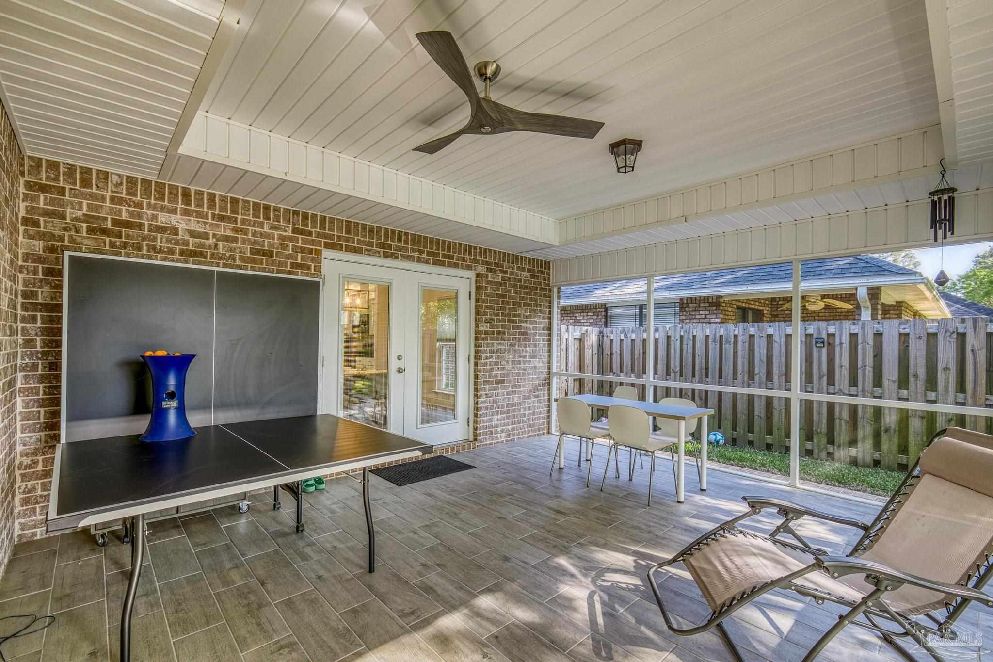 5981 Dunridge Drive Pace, FL 32571 - Photo 29 of 39 a view of a porch with furniture
