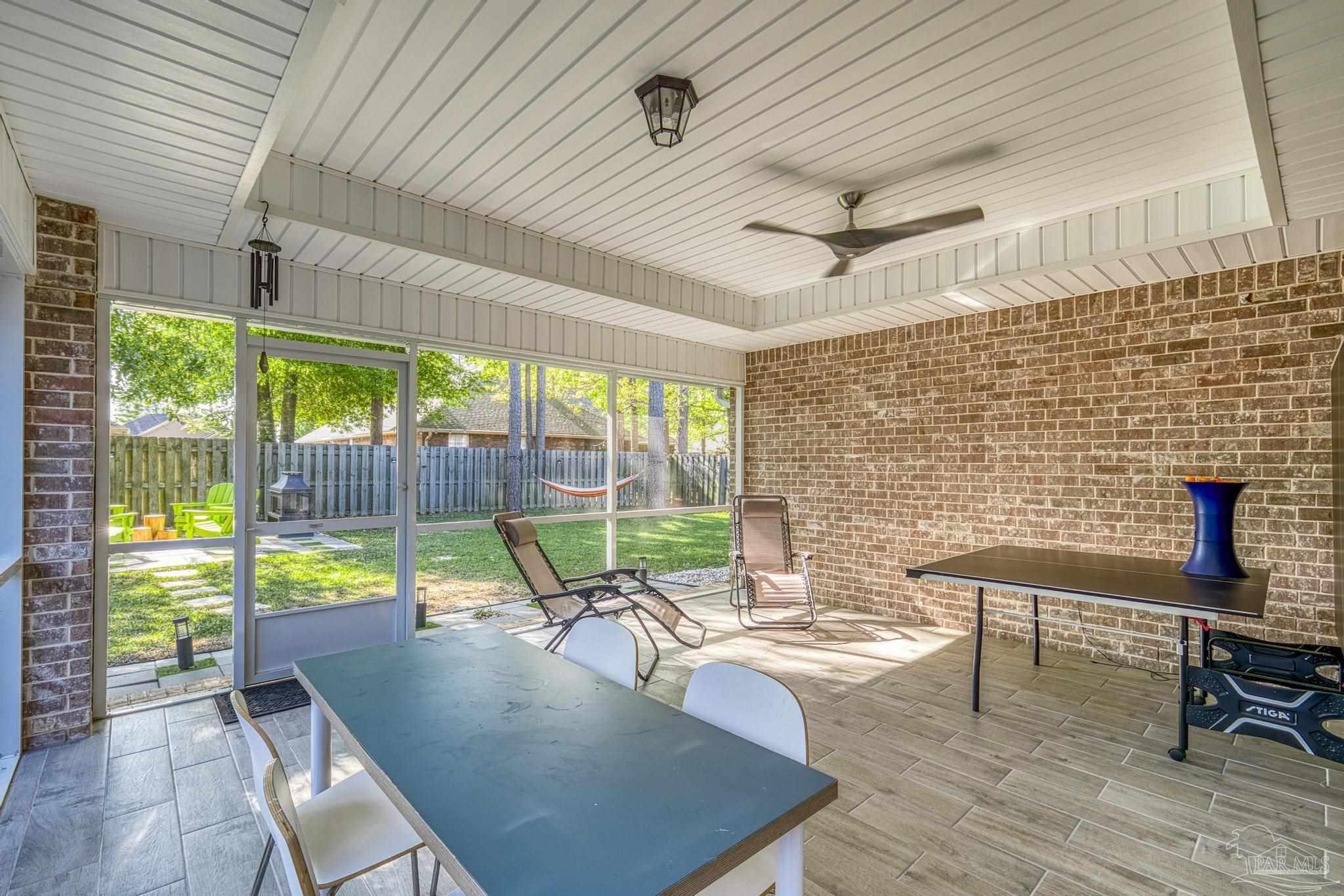 5981 Dunridge Drive Pace, FL 32571 - Photo 30 of 39 a view of a dining room with furniture window and outside view