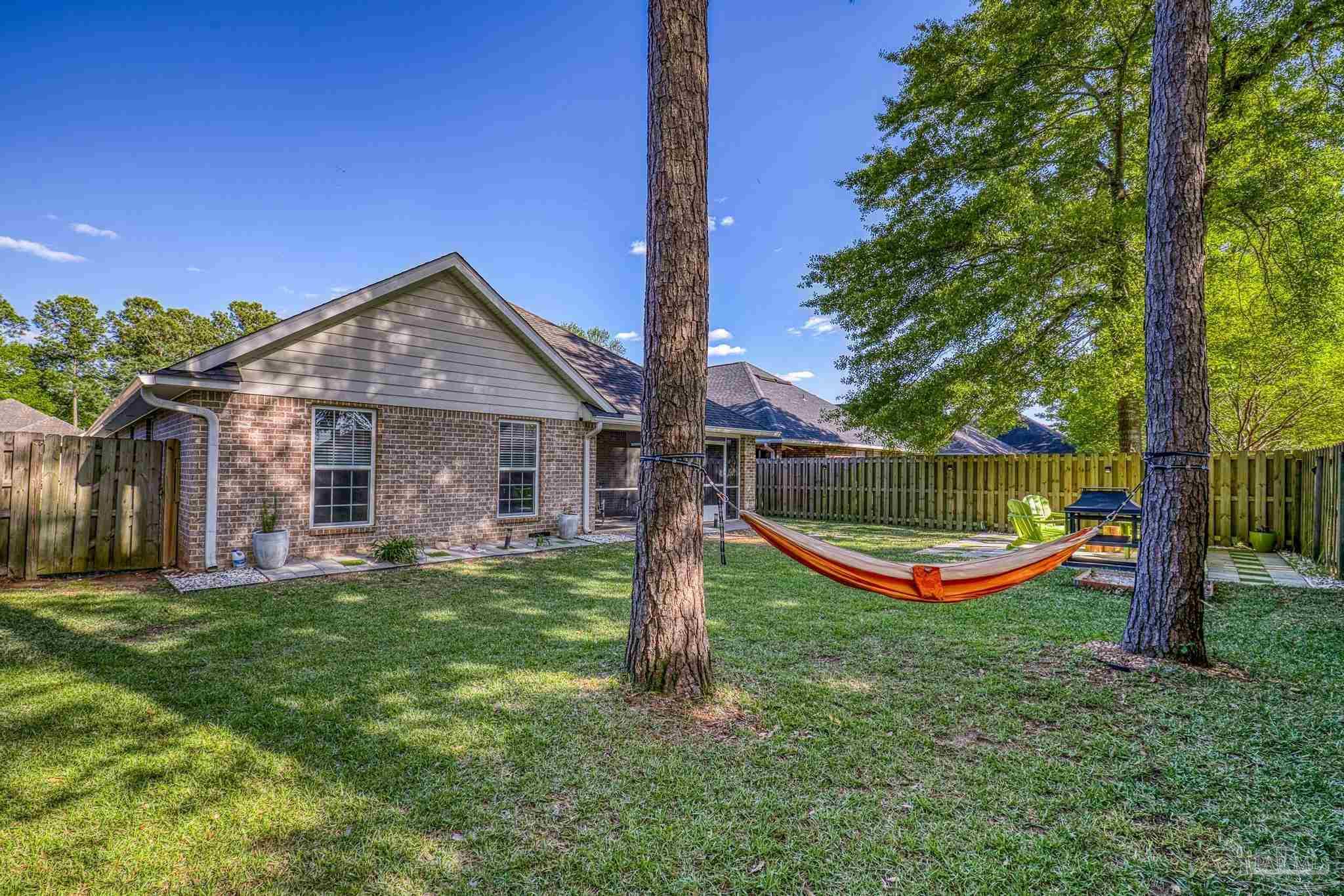 5981 Dunridge Drive Pace, FL 32571 - Photo 33 of 39 front view of a house with a big yard