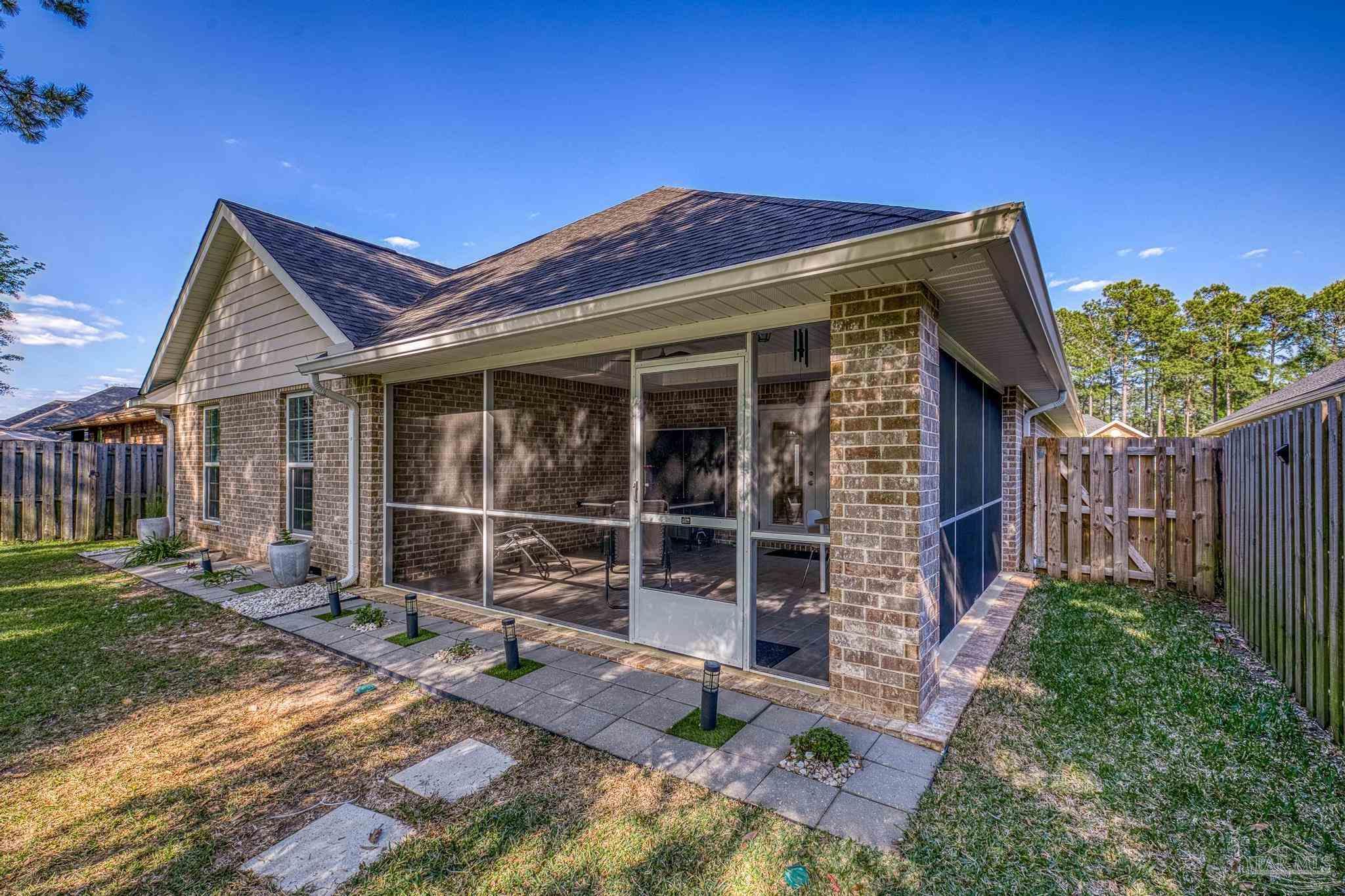 5981 Dunridge Drive Pace, FL 32571 - Photo 35 of 39 a view of house with backyard space and porch