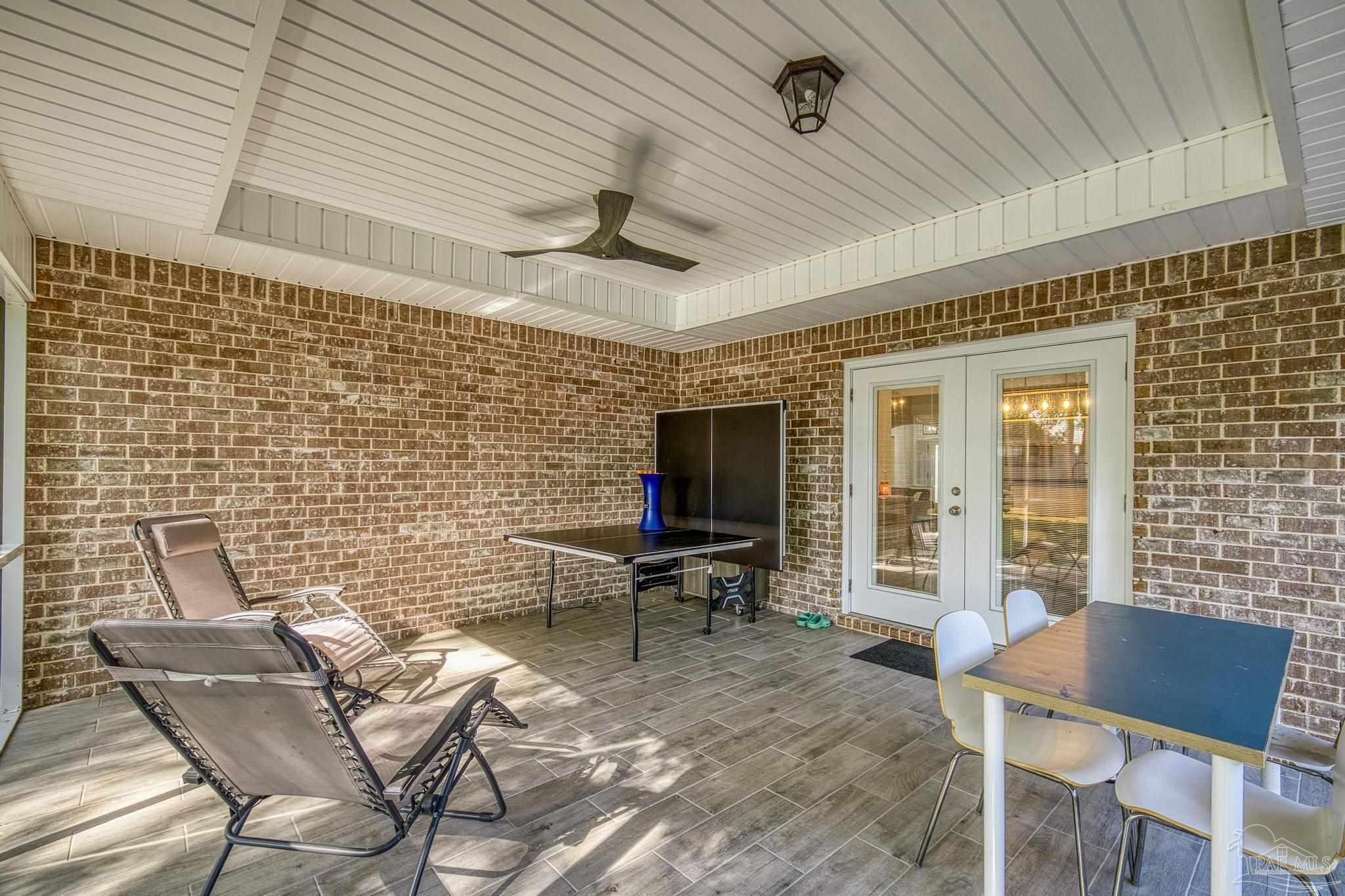5981 Dunridge Drive Pace, FL 32571 - Photo 5 of 39 a balcony with chairs and outdoor space
