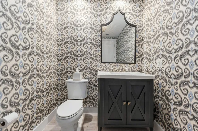 a bathroom with a toilet and a shower curtain