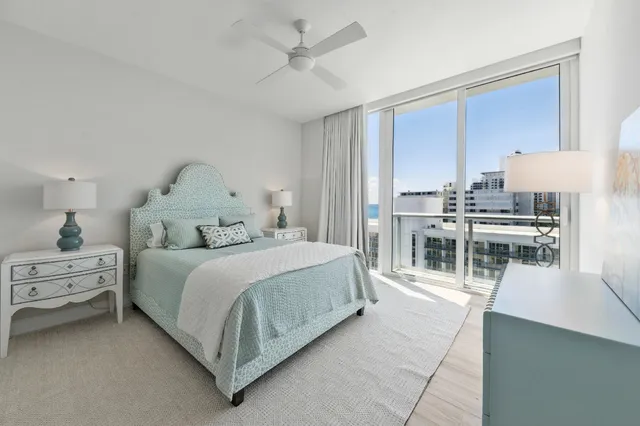 a bedroom with a bed and a table